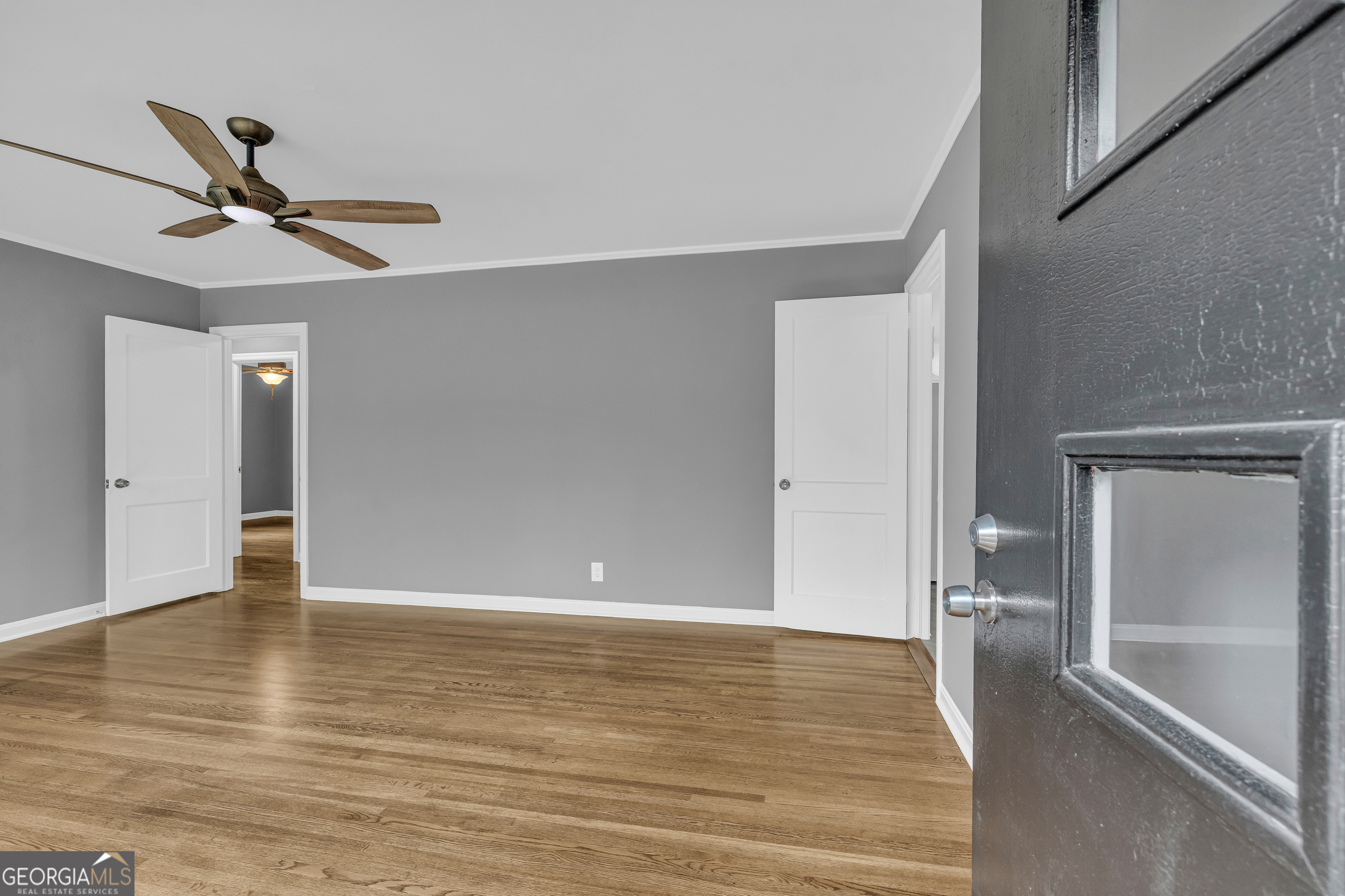 998 Rosedale Street Toccoa, GA 30577 - Photo 18 of 43 a view of an empty room with wooden floor and a window