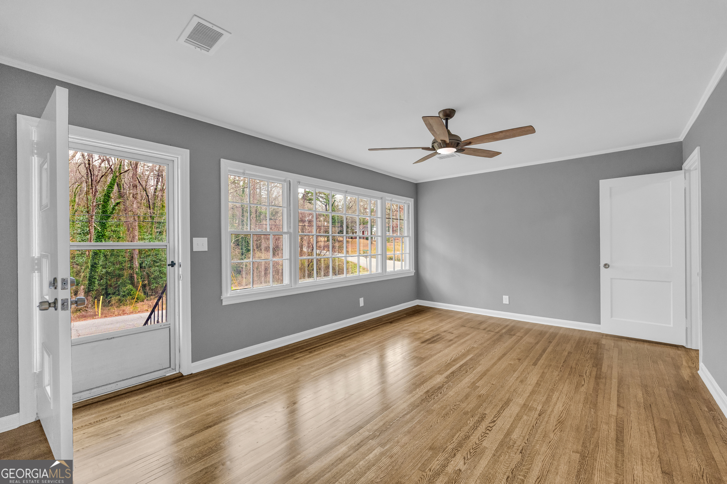 998 Rosedale Street Toccoa, GA 30577 - Photo 19 of 43 wooden floor in an empty room with a window