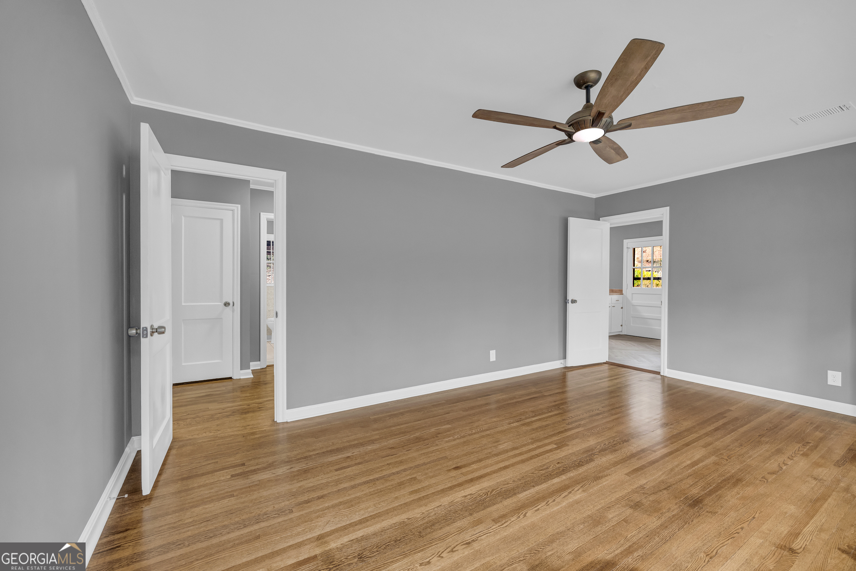 998 Rosedale Street Toccoa, GA 30577 - Photo 21 of 43 a view of empty room with wooden floor and ceiling fan