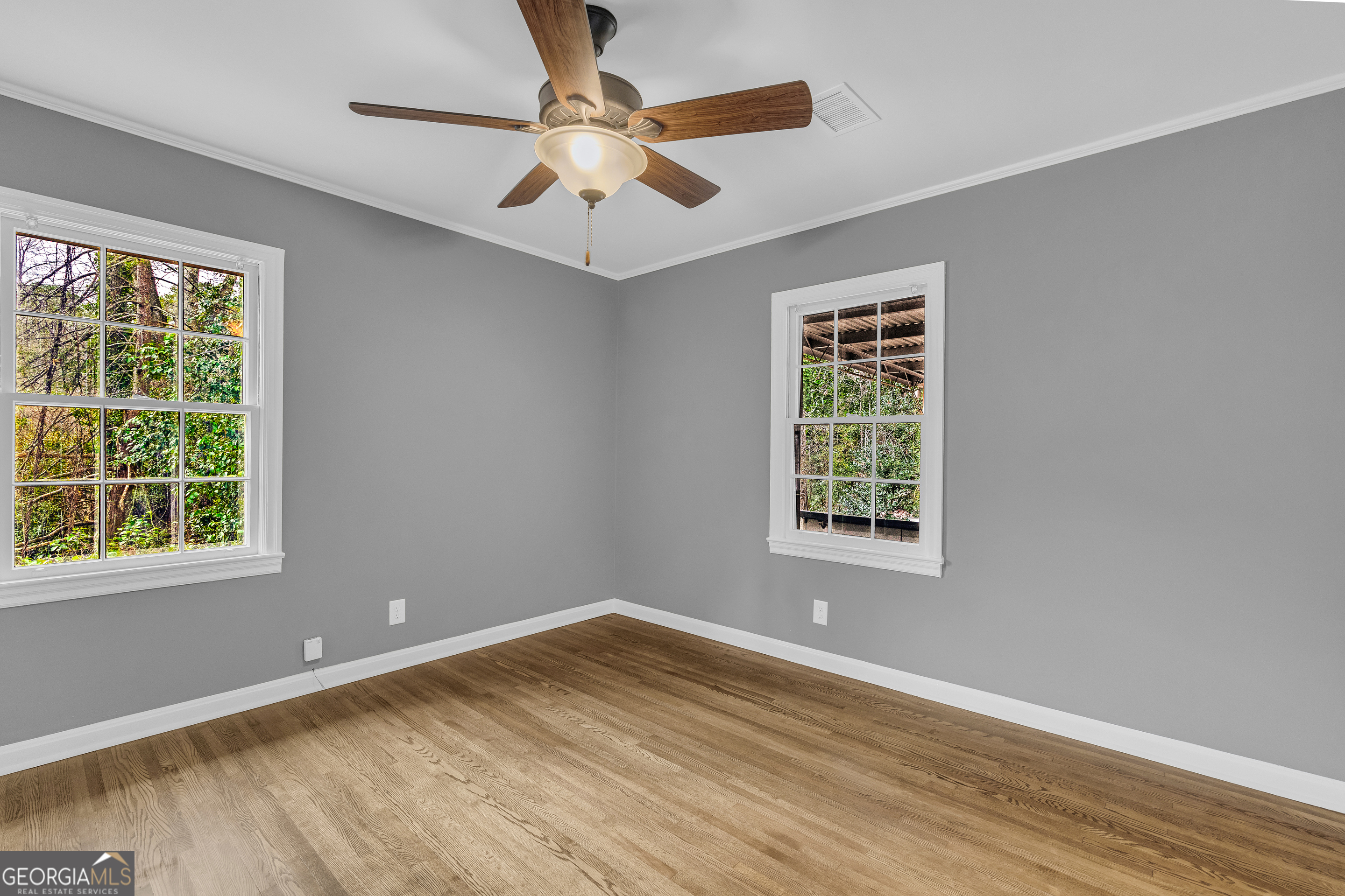 998 Rosedale Street Toccoa, GA 30577 - Photo 24 of 43 a view of an empty room with wooden floor and a window