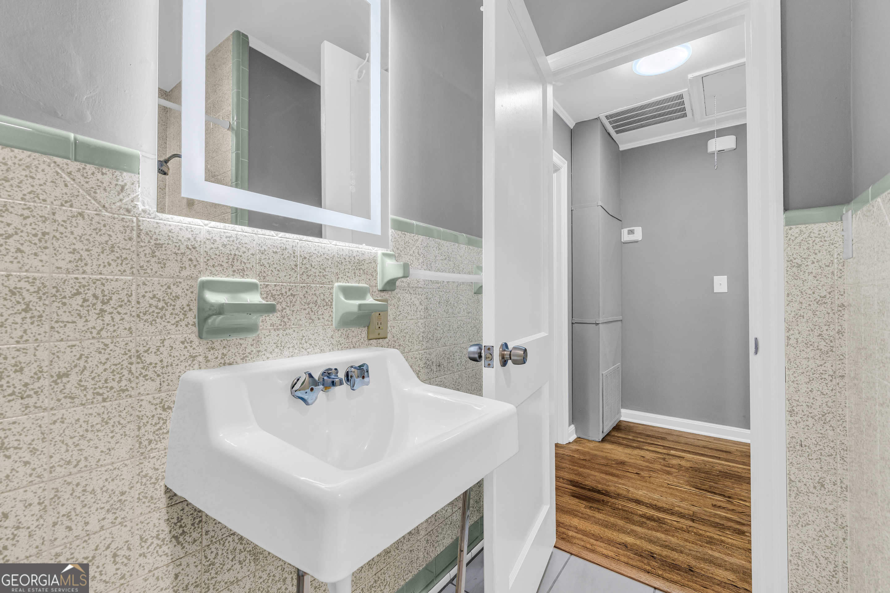 998 Rosedale Street Toccoa, GA 30577 - Photo 31 of 43 a bathroom with a sink and a mirror