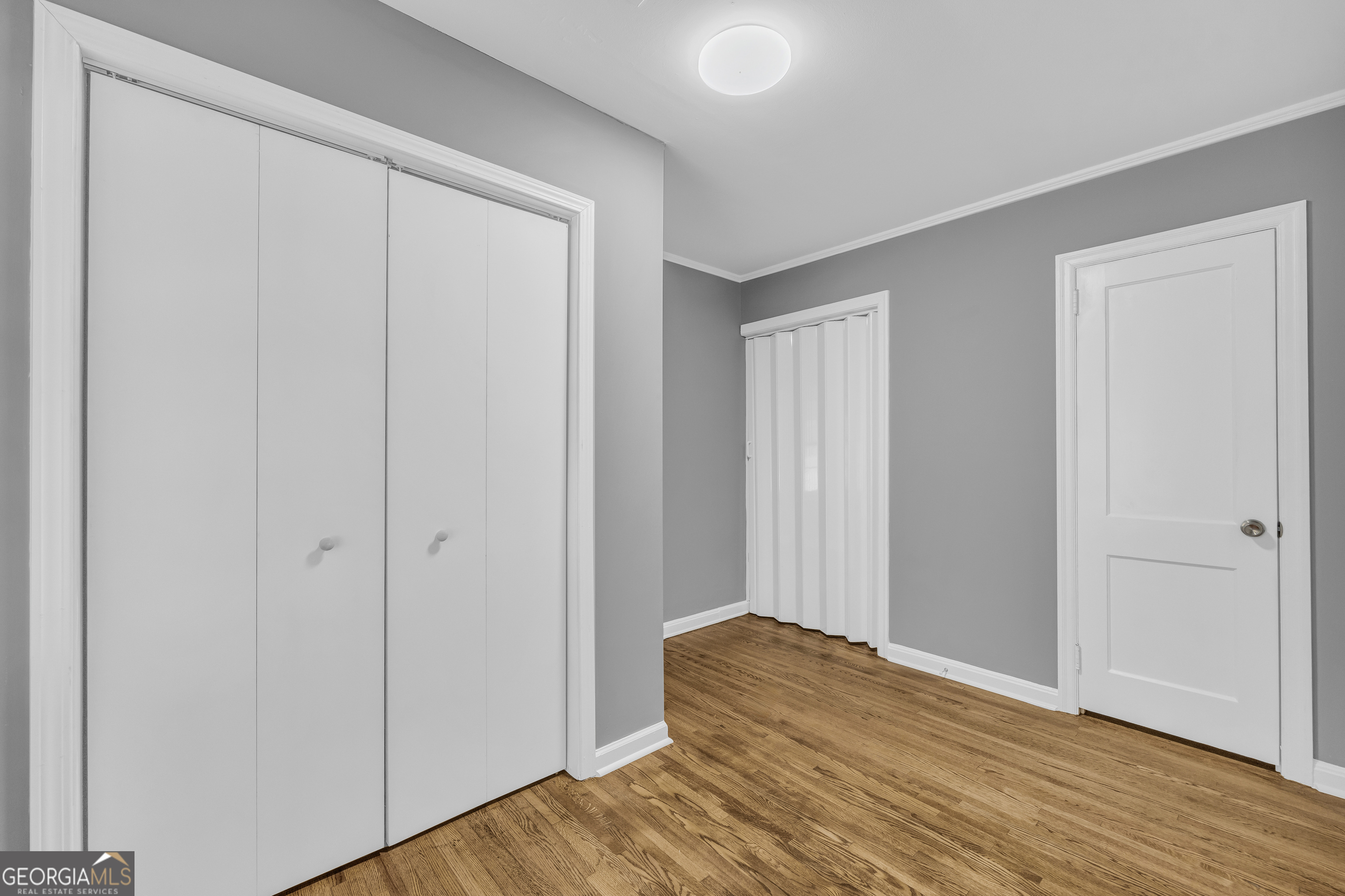 998 Rosedale Street Toccoa, GA 30577 - Photo 33 of 43 a view of a bedroom with wooden floor and closet