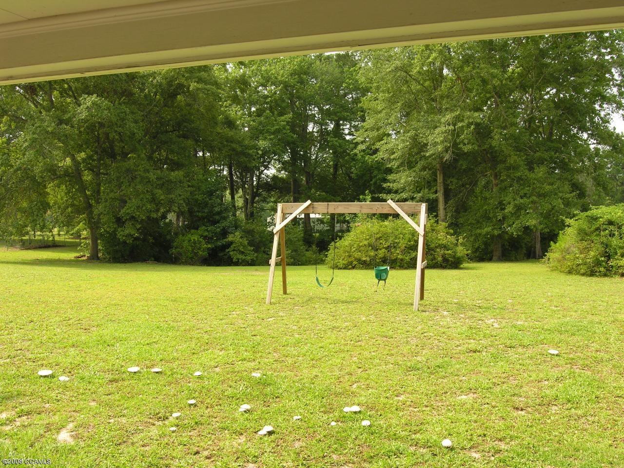 325 Nine Foot Road Newport, NC 28570 - Photo 13 of 13 Large fenced back yard w/pond