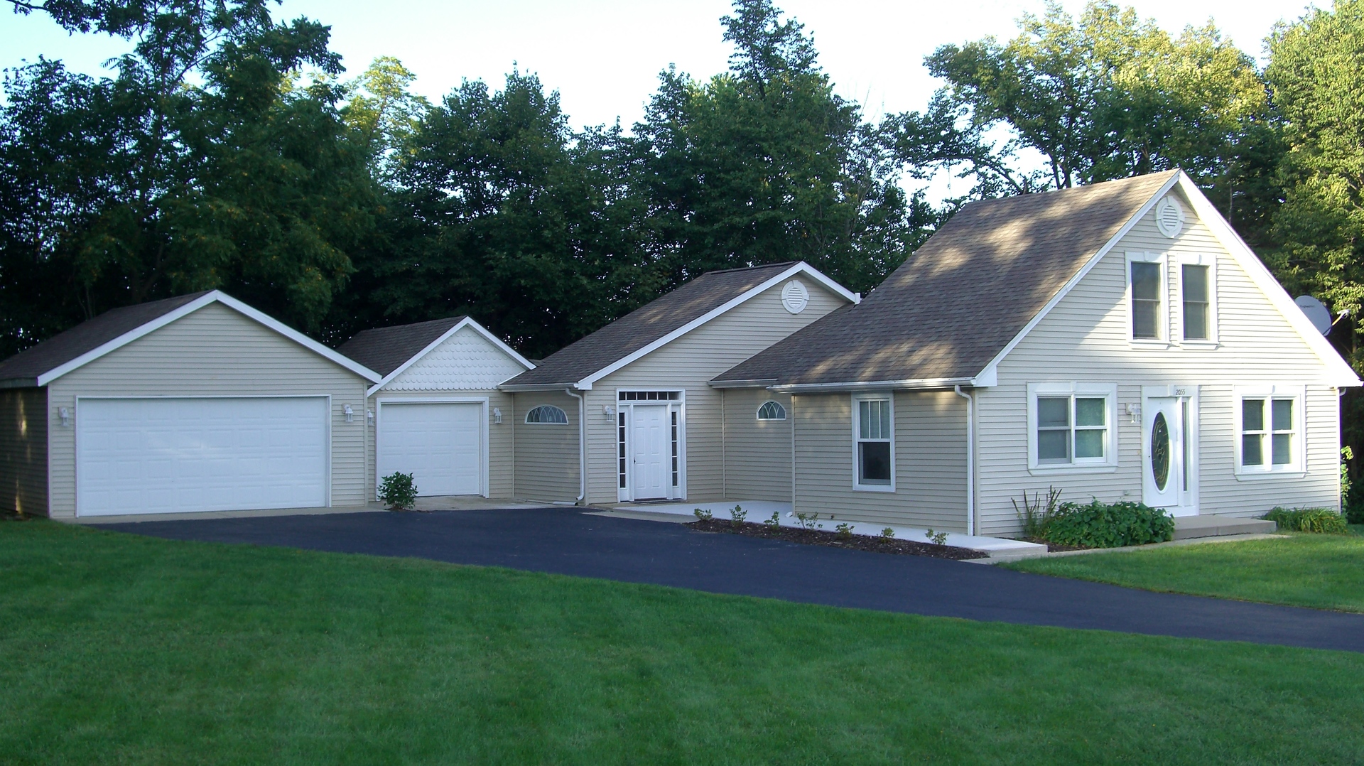 2055 North 35th Road Ottawa, IL 61350 - Photo 1 of 41 a front view of a house with a garden and yard