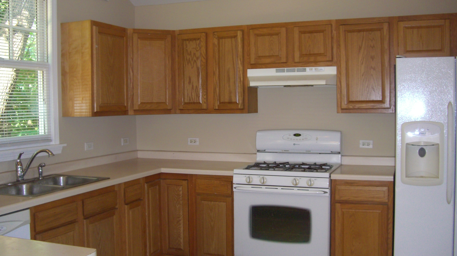 2055 North 35th Road Ottawa, IL 61350 - Photo 12 of 41 a kitchen with a stove top oven sink and cabinets