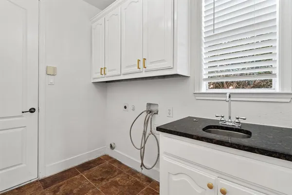 a bathroom with a sink and a window