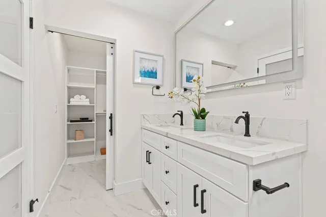 a view of storage and utility room with washer and dryer