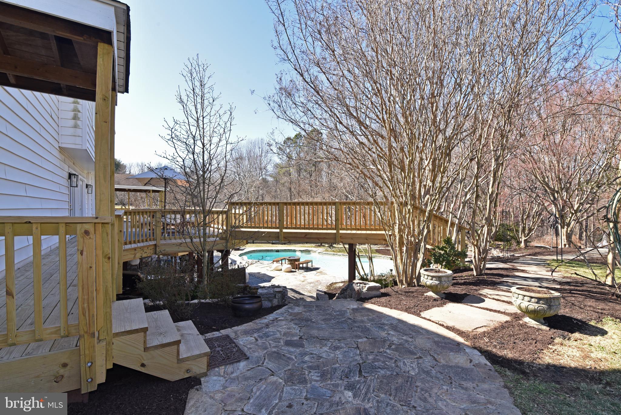 10502 Mt Sunapee Road Vienna, VA 22182 - Photo 40 of 49 Deck Bridge to Seating Areas, Side Yard, HotTub.