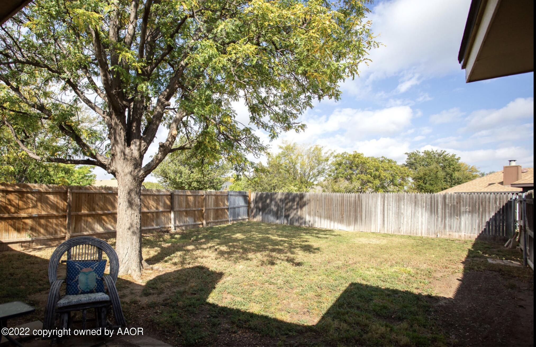 6700 Foothill Drive Amarillo, TX 79124 - Photo 14 of 17 a view of a large body of water with a fountain and a large tree