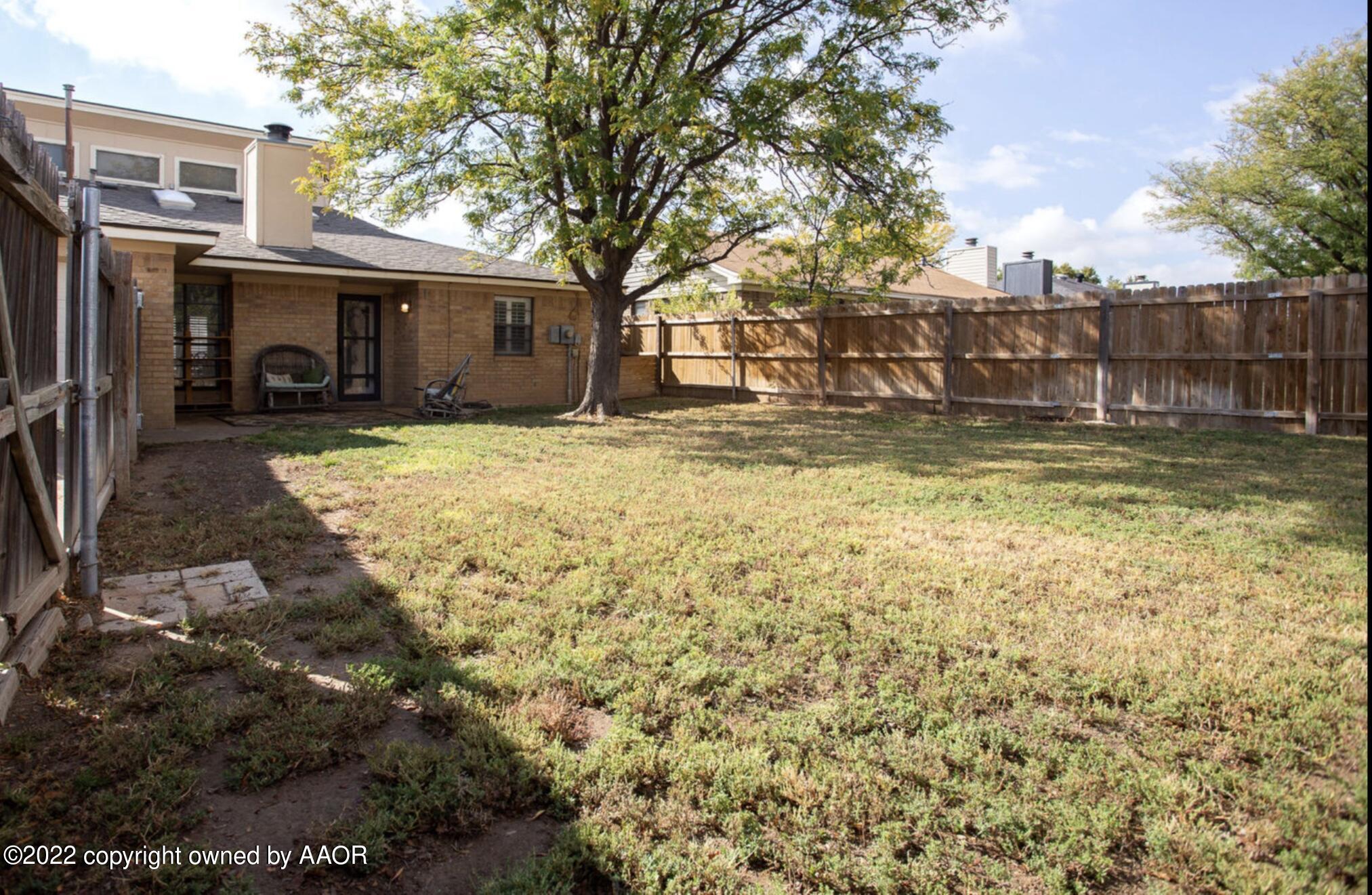 6700 Foothill Drive Amarillo, TX 79124 - Photo 15 of 17 front view of a house with a yard