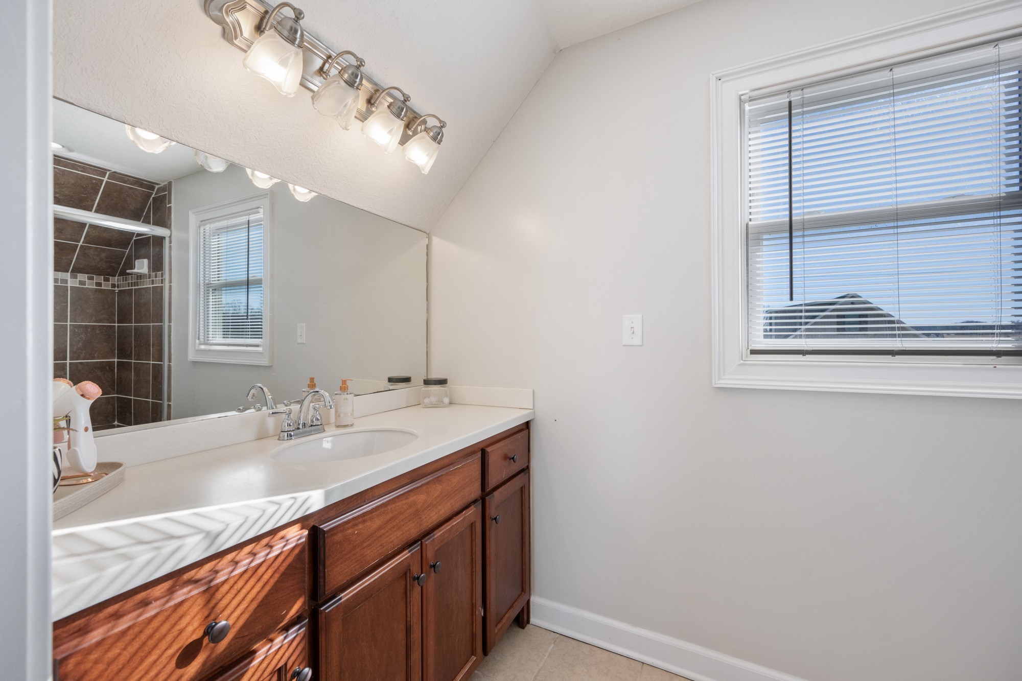 222 Fairway Villa Lane Decaturville, TN 38329 - Photo 22 of 36 a bathroom with a sink a vanity and a mirror