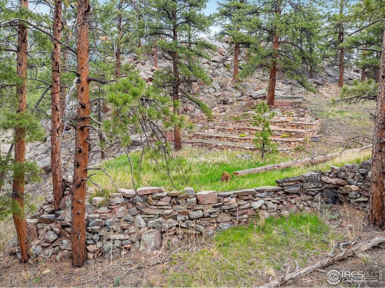 1289 Kiowa Road Lyons, CO 80540 - Photo 12 of 37 a big yard with fountain