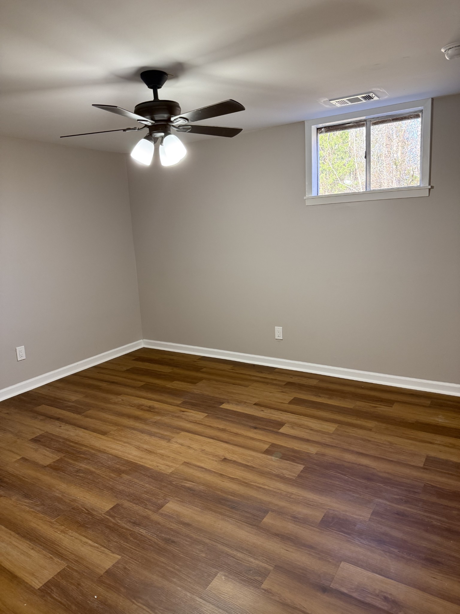 133 Mockerson Road Leoma, TN 38468 - Photo 18 of 20 a view of a room with wooden floor and fan