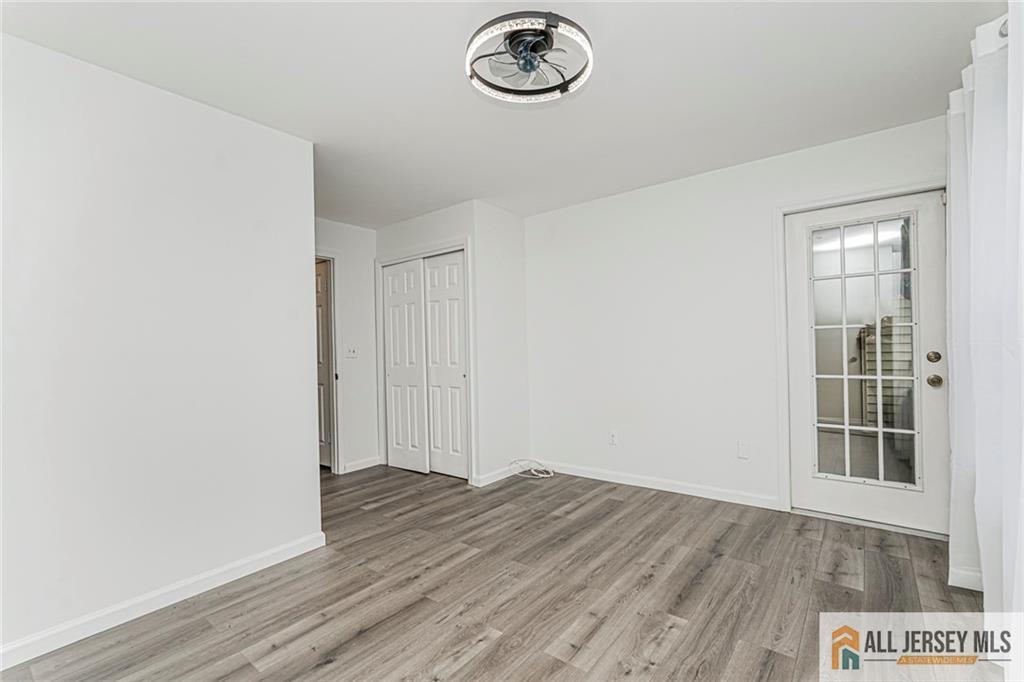 612 Chester Court Helmetta, NJ 08828 - Photo 5 of 31 a view of a livingroom with wooden floor