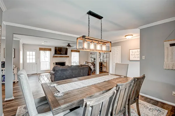 a living room with furniture flat screen tv and a fireplace