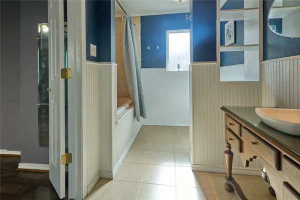a bathroom with a sink a mirror and a toilet