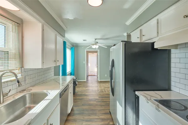a hallway with a washer and dryer