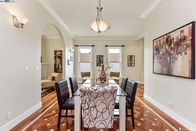 a view of a dining room with furniture window and wooden floor
