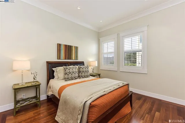 a bedroom with a bed and a night stand