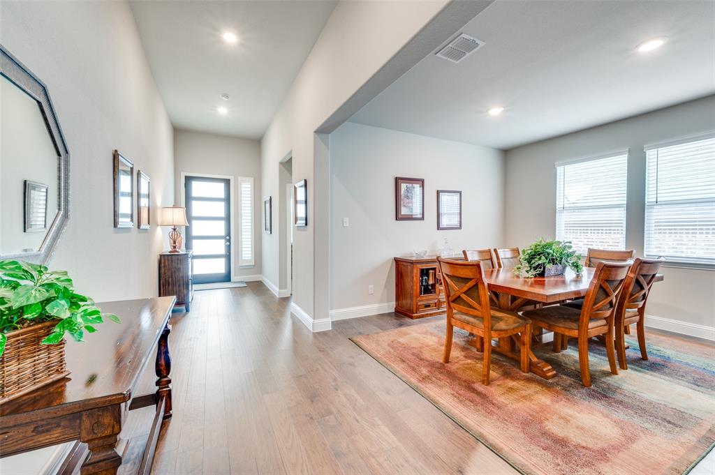 309 Savannah Lane Oak Point, TX 75068 - Photo 2 of 30 a view of a dining room with furniture and wooden floor