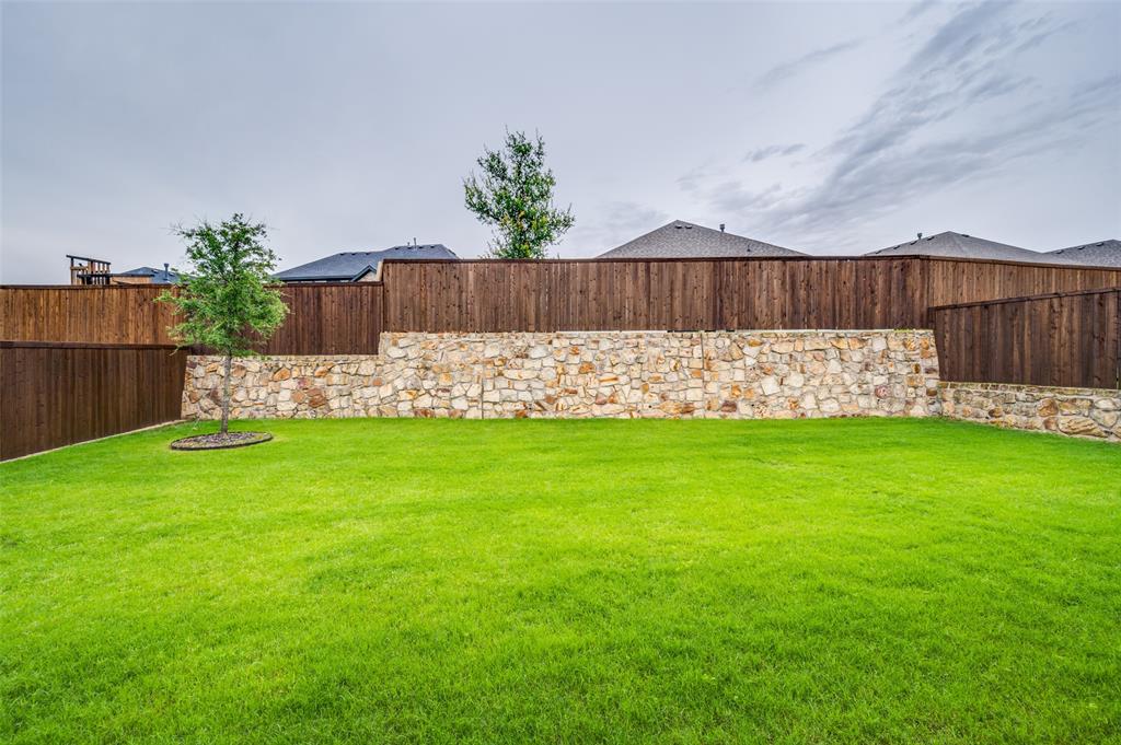 309 Savannah Lane Oak Point, TX 75068 - Photo 25 of 30 a view of yard with seating space