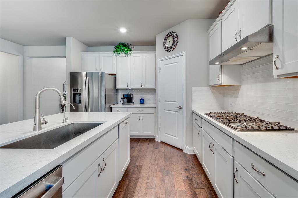 309 Savannah Lane Oak Point, TX 75068 - Photo 4 of 30 a kitchen with cabinets a sink and appliances