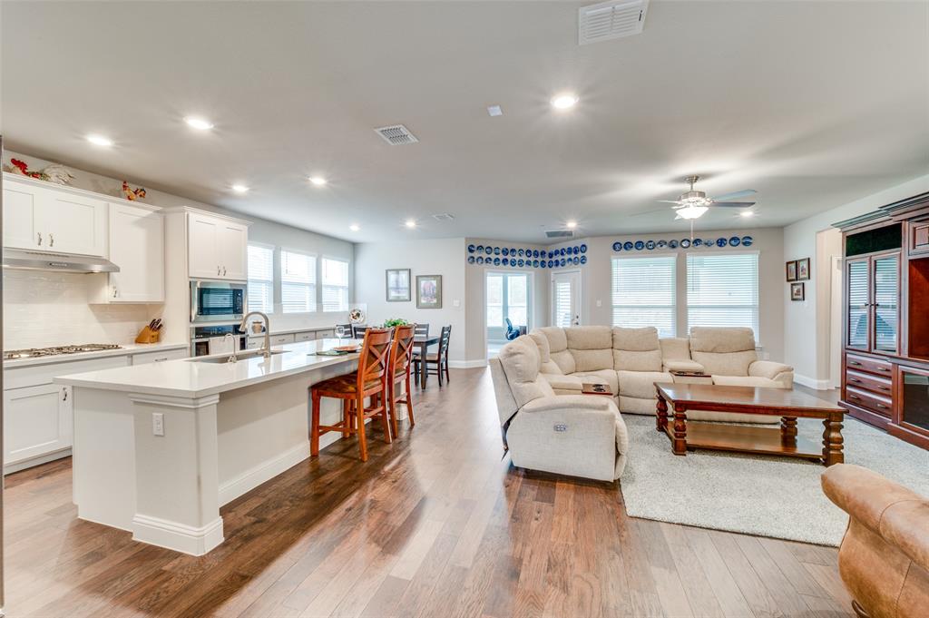309 Savannah Lane Oak Point, TX 75068 - Photo 8 of 30 a large living room with stainless steel appliances kitchen island a large window