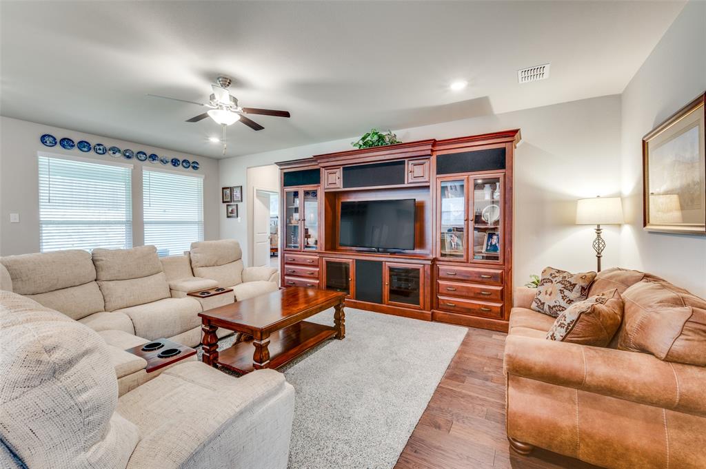 309 Savannah Lane Oak Point, TX 75068 - Photo 10 of 30 a living room with furniture and a flat screen tv