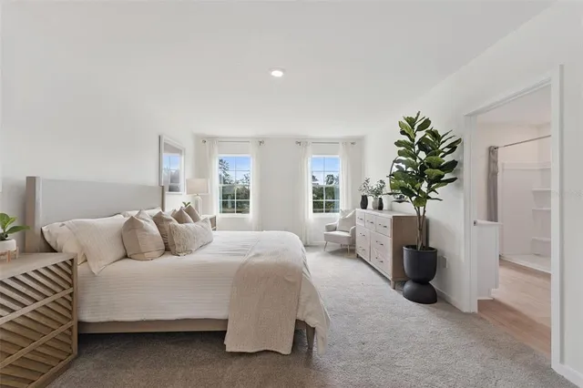 a bedroom with a bed and a sink