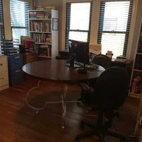 a view of a dining room with furniture and window