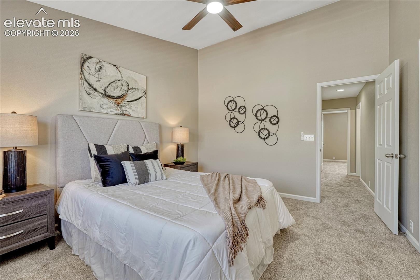 4147 Diamond Ridge View Colorado Springs, CO 80918 - Photo 17 of 42 Soaring vaulted ceilings and plush new carpet turn the primary bedroom suite into an airy, quiet sanctuary of pure comfort