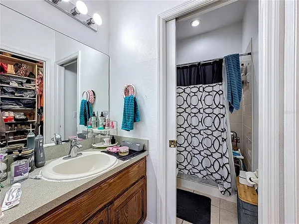 a bathroom with a sink double vanity and a mirror