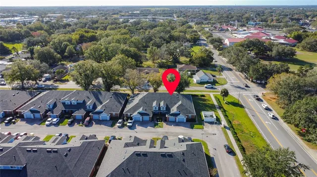 an aerial view of house with yard swimming pool and outdoor seating