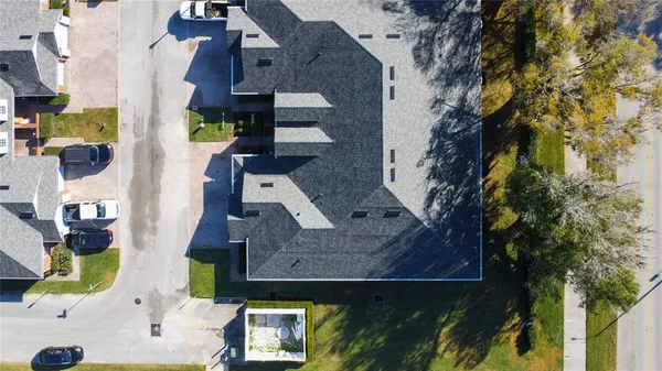 an aerial view of houses with outdoor space