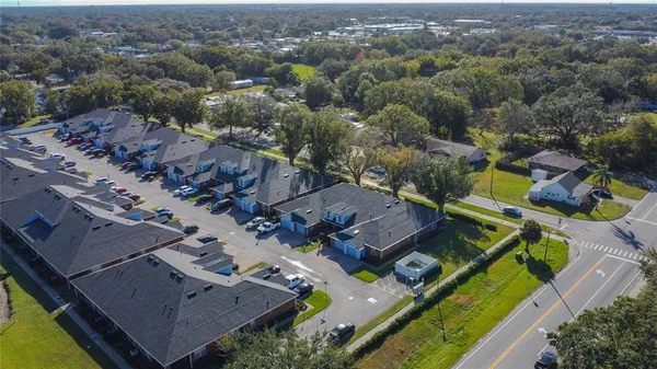an aerial view of residential houses with outdoor space