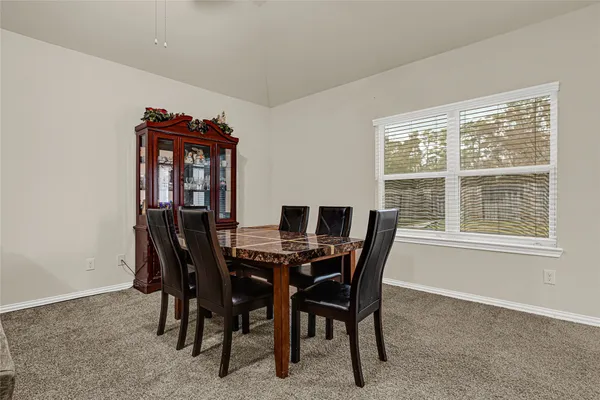 a view of a dining room with furniture