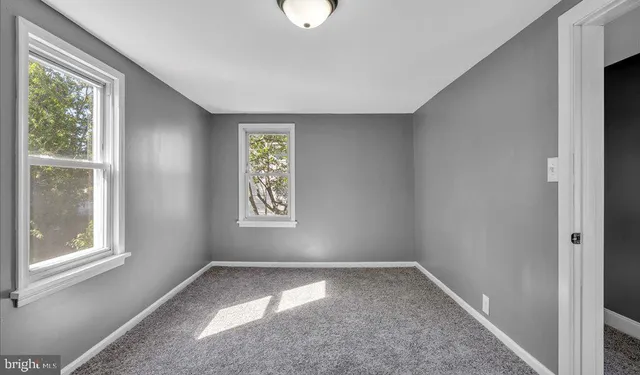 an empty room with windows