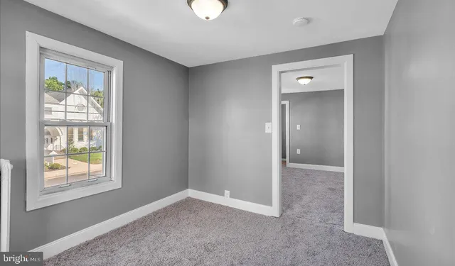 an empty room that has a window