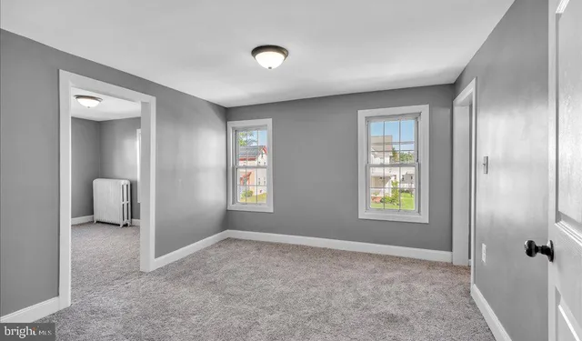 a big room with windows and closet