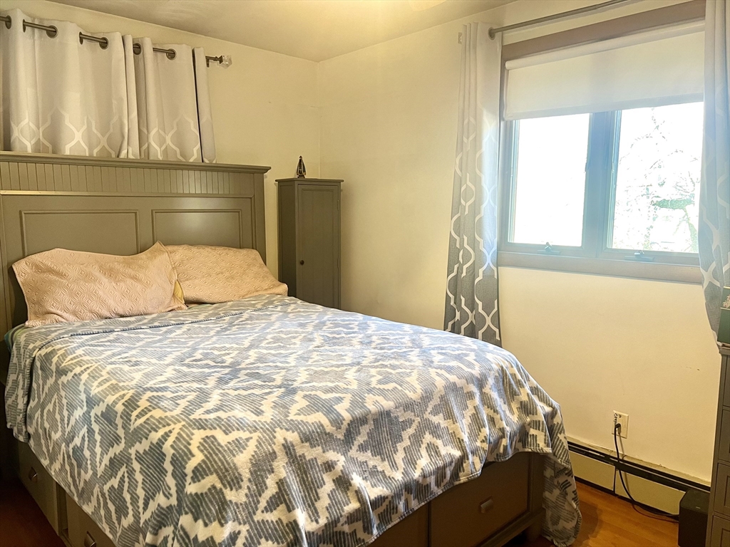 7 Ballydrain Road Framingham, MA 01701 - Photo 3 of 11 a bedroom with a bed and window