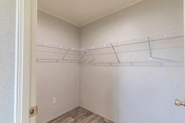 a view of a room with racks on the wall