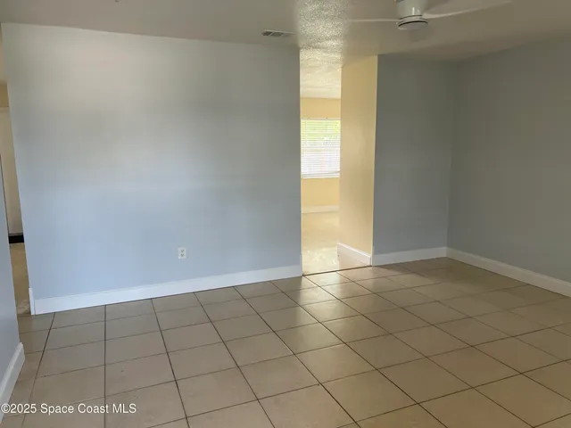 en empty room with windows