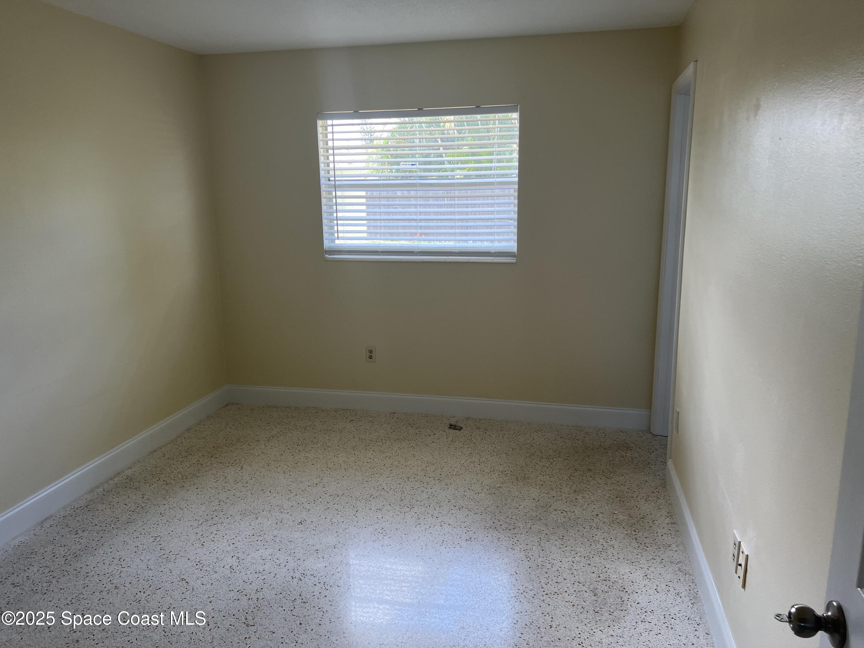 2906 Rollins Street Melbourne, FL 32901 - Photo 10 of 12 an empty room with a window