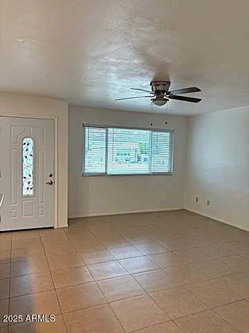 a view of an empty room with a window