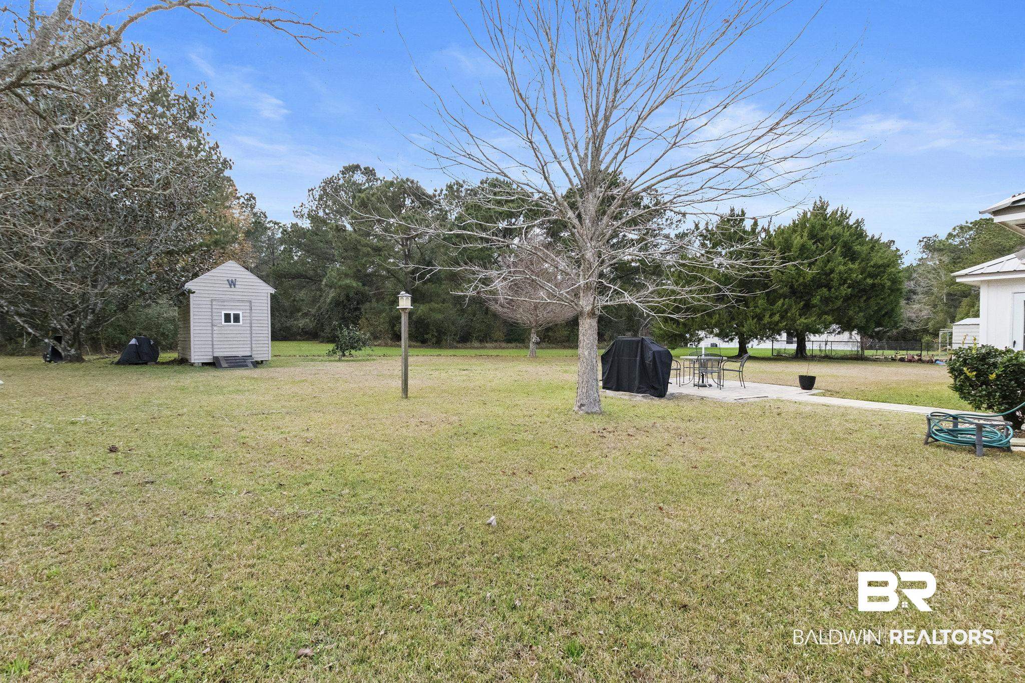 14031 Brook Hollow Road Summerdale, AL 36580 - Photo 52 of 56 View of yard with a storage shed