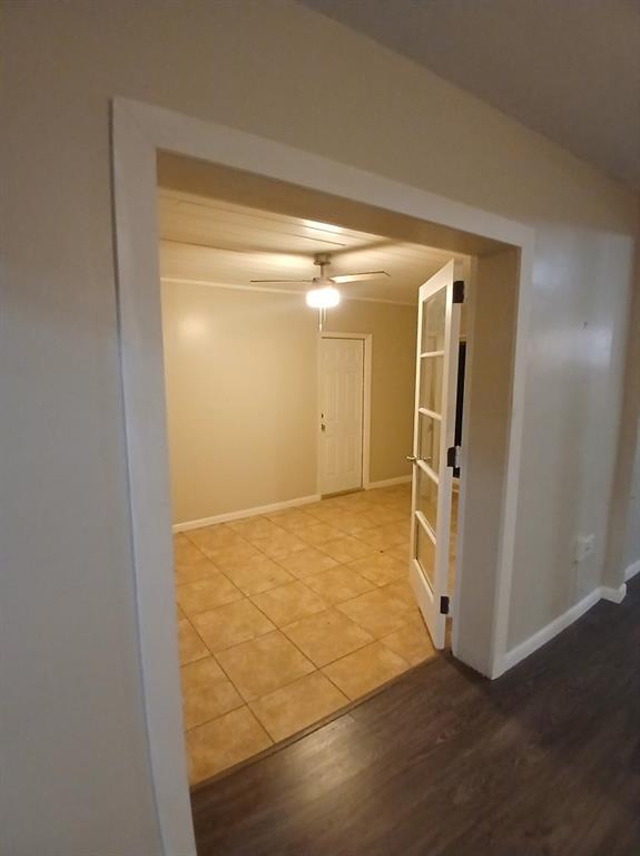 5759 Southwest 61st Street Miami, FL 33143 - Photo 6 of 9 a view of a hallway with wooden cabinets
