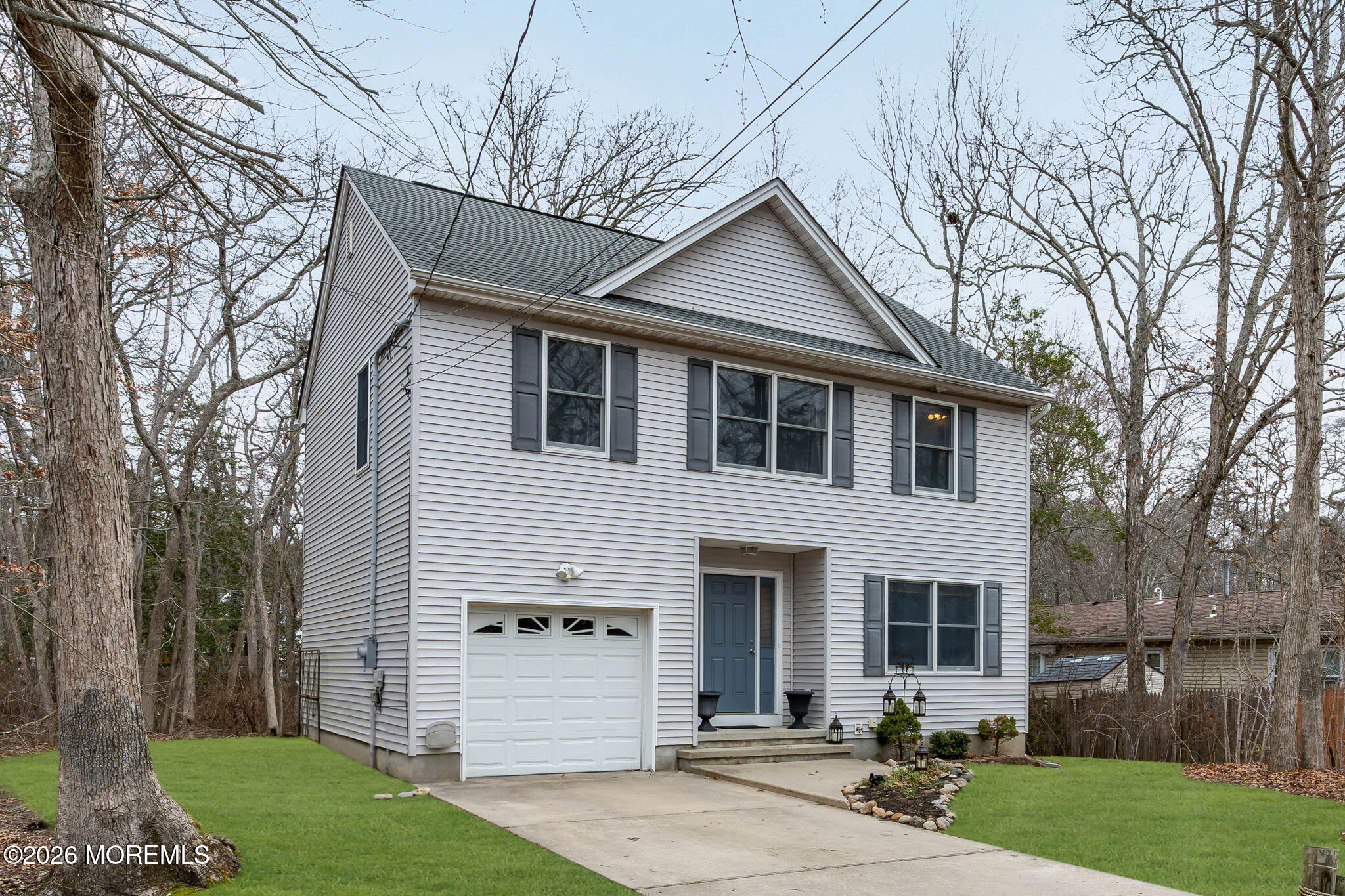 9 Forecastle Way Waretown, NJ 08758 - Photo 3 of 51 a front view of a house with a yard