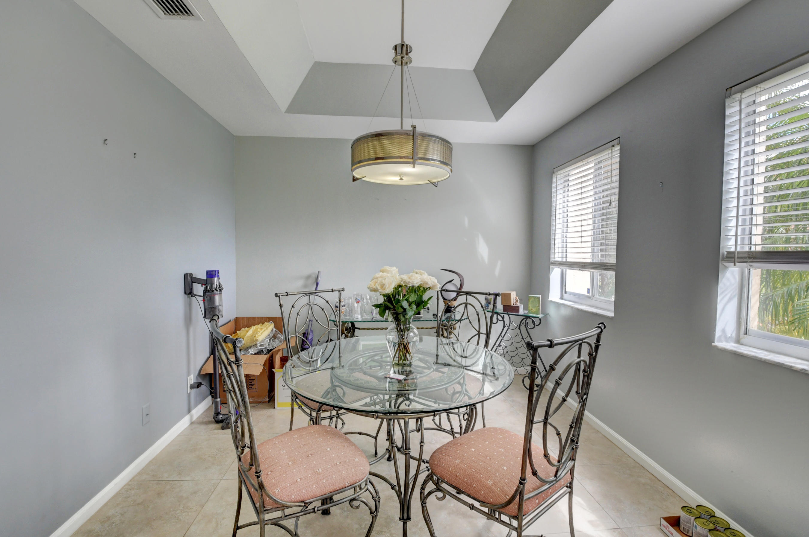 23061 Aqua View, Unit 1 Boca Raton, FL 33433 - Photo 12 of 29 a dining room with furniture and window