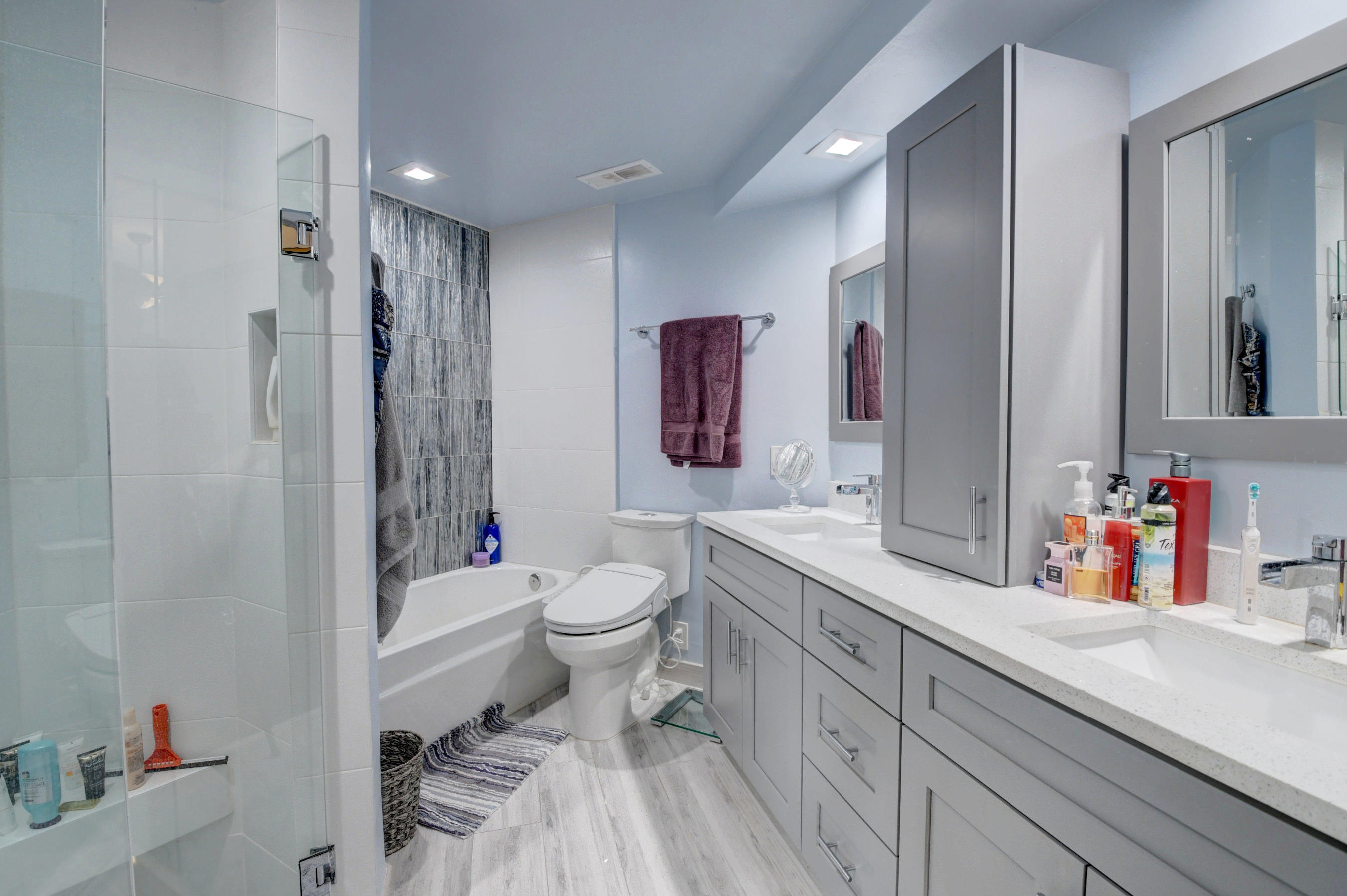 23061 Aqua View, Unit 1 Boca Raton, FL 33433 - Photo 23 of 29 a bathroom with a sink toilet vanity and shower