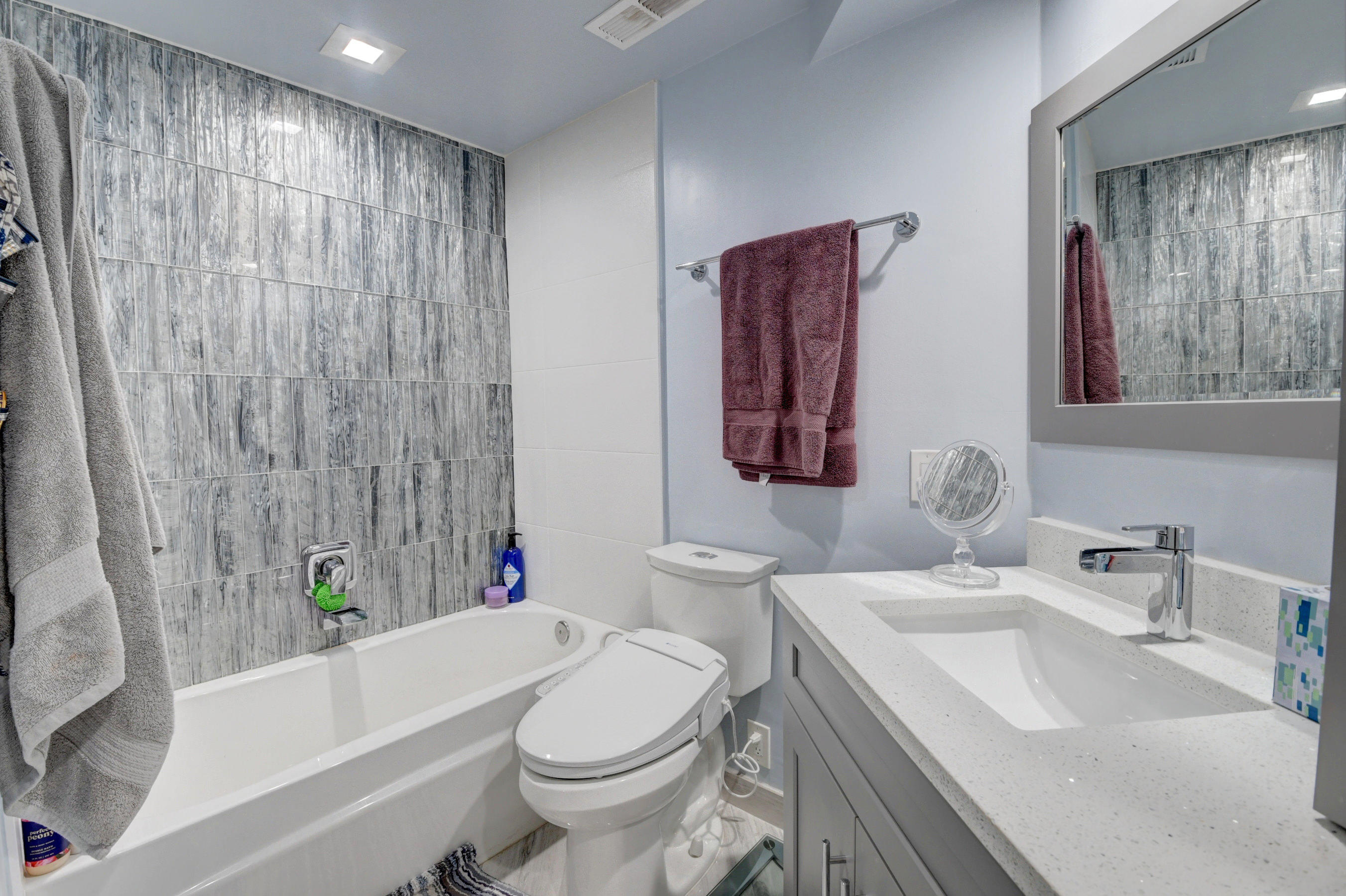 23061 Aqua View, Unit 1 Boca Raton, FL 33433 - Photo 25 of 29 a bathroom with a sink toilet and bathtub